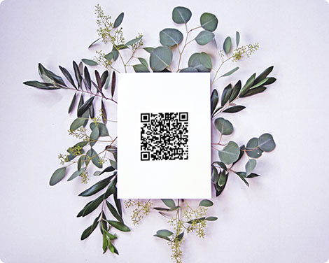 QR code on a card and leaves decorations